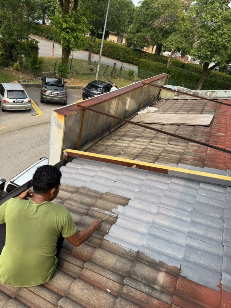 Roof tile repainting and restoration job in a Petaling Jaya neighborhood
